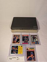 Photo of two hardcover books and six Wayne Gretzky hockey cards laid out in front.