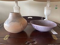 Overall view of both pottery pieces on table