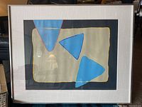Front view of the framed abstract painting showing composition and frame.