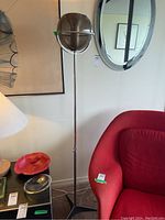 Full view showing globe shade, pole and tripod base