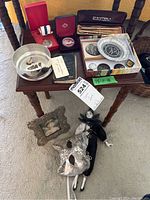 Overview of all items arranged on small table and floor