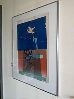 Framed abstract print on wall showing overall colors and composition