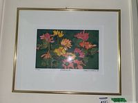Full front view of framed floral print on white wall