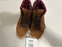 Top-down view of a pair of brown men's shoes size 9 with plaid padded collar lining and lace-up closure, showing overall good condition.