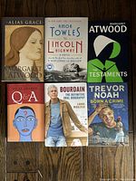 Top down photo of lot of 6 hardcover books showing front covers