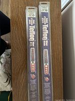 Photo of two packaged MotoMaster Teflon windshield wiper blades showing sizes 20" and 24"