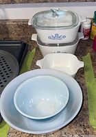 Full set of five bowls including Corningware, Pyrex, and glass bowls displayed together