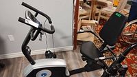 Side view of Xterra xT2201 recumbent exercise bike showing digital console, handlebars, and seating.