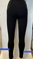 Front view of the black Dynamite leggings showing full length and fit on a mannequin or model.