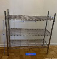 Photo showing 3 tier metal wire shelf unit with dimensions marked: 36 inches height, 35 inches width, 14 inches depth.