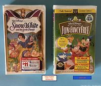 Photo showing two factory sealed Disney Masterpiece Collection VHS tapes: Snow White and the Seven Dwarfs and Fun and Fancy Free (50th Anniversary Limited Edition).