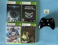 Four Xbox 360 game cases and black controller placed on blue background, showing front cover art of Resident Evil Revelations, Dead Space 2, Alien Isolation Nostromo Edition, and Madden NFL 25.