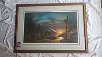 Full view of the framed print showing the landscape artwork including a flying eagle and sunset.