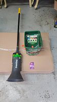 Smart One weed control applicator and Scott's handheld fertilizer broadcast applicator placed on cardboard base.jpg