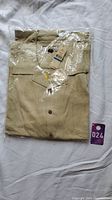 Original packaged light beige Tommy Bahama men's shirt, size XXL, tagged.