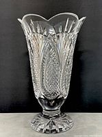 Front view of the Waterford crystal vase showing detailed cut patterns and flared scalloped rim.