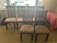 Six chairs grouped in front of window, front view