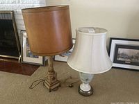 Two vintage table lamps together showing overall size, shades, and bases.