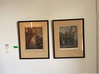 Four framed prints hanging on a wall, showing varying outdoor scenes with people and animals.