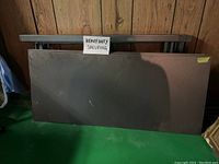 Front view of heavy duty shelving metal frame with five MDF shelves stacked in front, showing size and heavy-duty construction