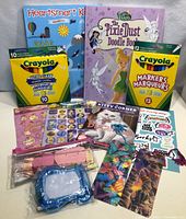 Lot contents showing both Crayola marker packs, two coloring books, and multiple sticker sheets in clear bags.