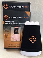 Copper88 wrist sleeve in original packaging, front view showing product and logo.