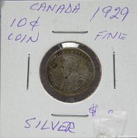 Front view of 1929 Canada 10 cents silver coin showing King George V portrait in protective holder with handwritten notes.