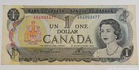 Front view of the 1973 Canadian one dollar banknote showing Queen Elizabeth II and the serial number.