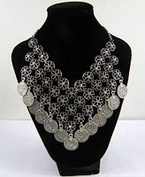 Bedouin Egyptian tribal style coin necklace displayed on black bust, showing full front view with multiple coin pendants and intricate filigree design.