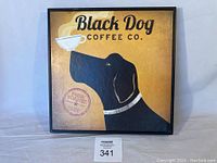 Full square view of the wall art showing the black dog, coffee cup, and text with frame.