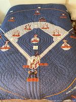 Full view of twin baseball quilt featuring diamond layout and embroidered player positions