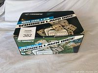 Photo showing original Triumph Big Roller Wooden Lawn Dice box with dice and scorecard images.