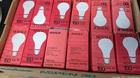 Photo of the 36 unopened Royale lightbulb boxes with red packaging showing wattage and expected lifespan.