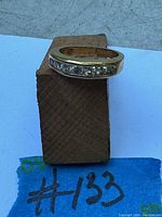 Top view of 10K gold ring showing channel-set diamonds