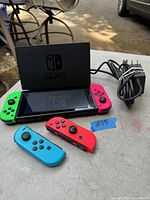 Full lot including console, dock, power adapter, and four Joy-Con controllers