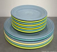 Stacked view of Fiesta plates showing different colors and sizes.
