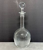 Front view of clear Baccarat crystal decanter showing the full shape and cut pattern