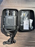 Creative XP black night vision binoculars in black hard case with accessories packed inside the case.