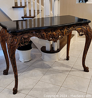 Frontal view of the console table showing overall design and condition