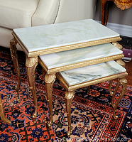 Three nested tables side view front showing all three marble tops and legs
