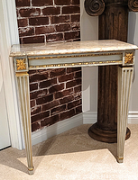 Front view of entire table showing marble top, base and wear