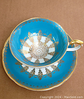 Teacup and saucer set showing overall design and condition.