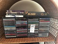 Front view of the collection showing multiple stacked CDs arranged in a CD holder. Includes visible CD spines with various artist names and titles.