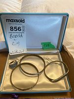 Overview photo of two bracelets and one ring in a light blue box with satin lining, marked 925