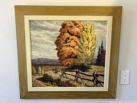 Front view of the framed oil painting showing the autumn landscape scene with a rustic fence and trees.