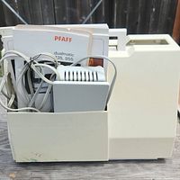 Rear of carrying case holding manual and power cables