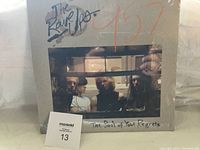 Front cover of The Rave Ups The Book of Your Regrets sealed vinyl album showing band photo and album title.