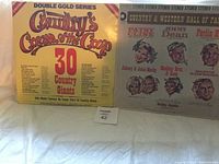 Two vinyl album covers titled 'Country's Cream of the Crop Double Gold Series' showing front sides with artist illustrations and text