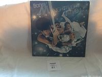 Front cover of Boney M Nightflight to Venus album showing the band's space-themed illustration with four members floating in space.