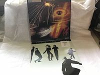 Front covers of two vinyl albums on white fabric backdrop, showing Pete Haycock and The Other Ones titles.